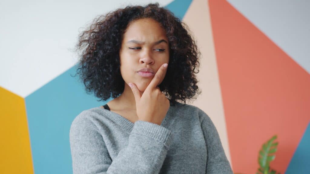 A photo where a person is thinking about getting an umbrella insurance.