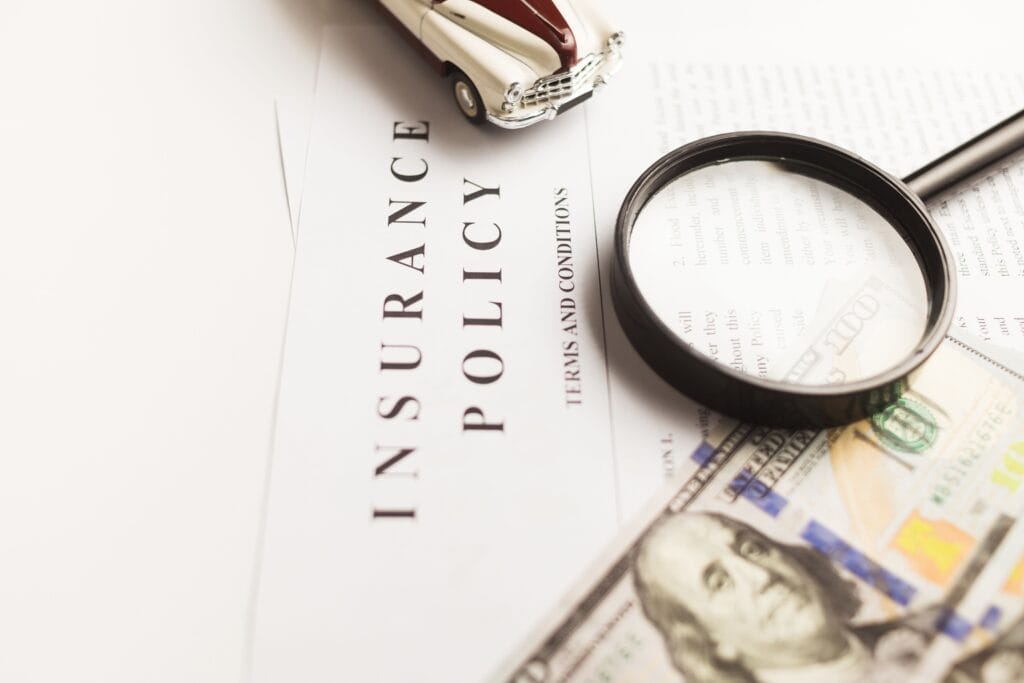 Image illustrating a policy with a magnifying glass lens to refer to the coverage.