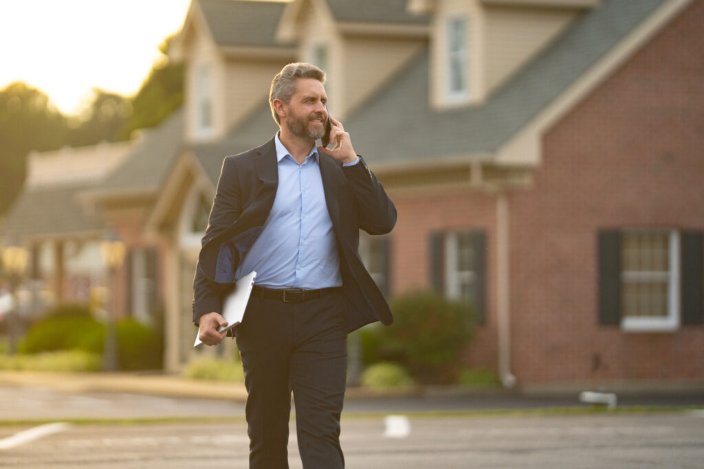 Landlord discussing insurance coverage and potential policy exclusions with an insurance agent before protecting a rental property.